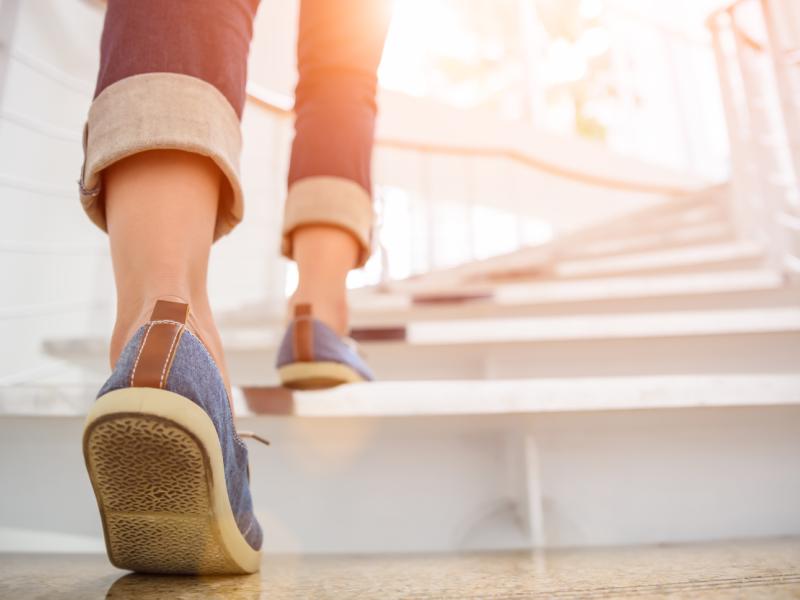 
A person walks up stairs